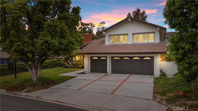 5431 Via Ontiveros, Yorba Linda, CA 92887 - view of front of house featuring a front yard, a tiled roof, a chimney, and driveway