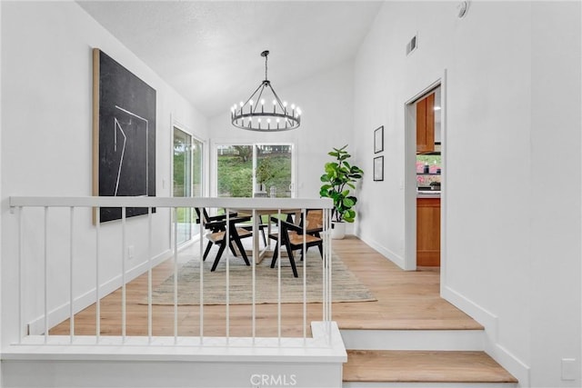 5431 Via Ontiveros, Yorba Linda, CA 92887 - dining room with lofted ceiling, baseboards, light wood finished floors, an inviting chandelier, and visible vents