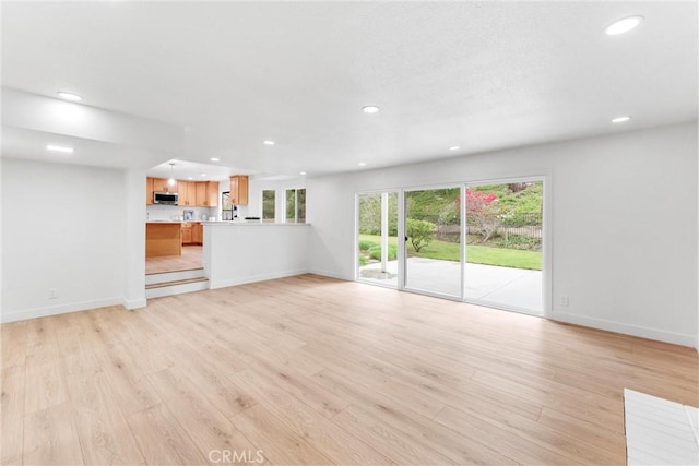 5431 Via Ontiveros, Yorba Linda, CA 92887 - unfurnished living room featuring baseboards, light wood-type flooring, and recessed lighting