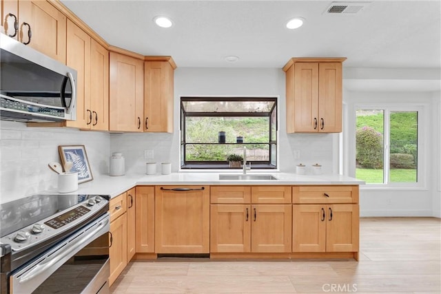 5431 Via Ontiveros, Yorba Linda, CA 92887 - kitchen with a sink, stainless steel appliances, visible vents, light countertops, and recessed lighting