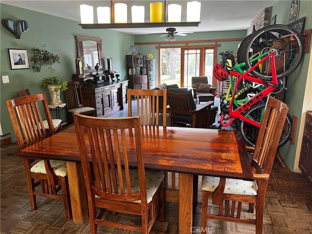 dining area with a wealth of natural light and a ceiling fan