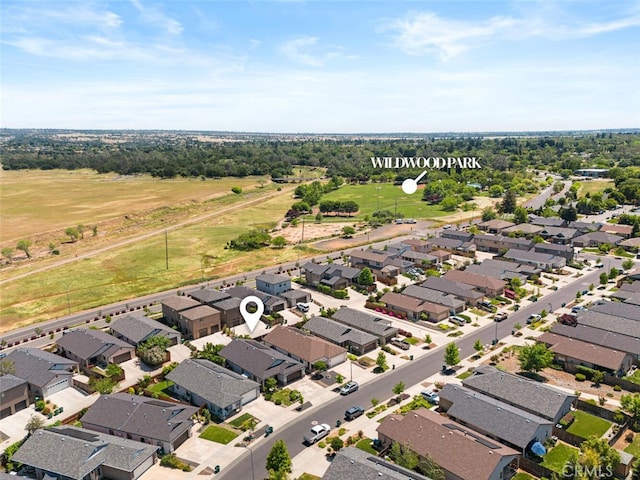 birds eye view of property with a residential view
