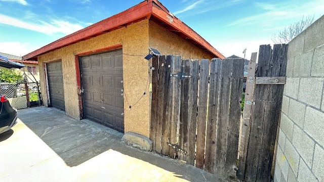 garage with fence