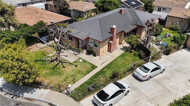 birds eye view of property with a residential view