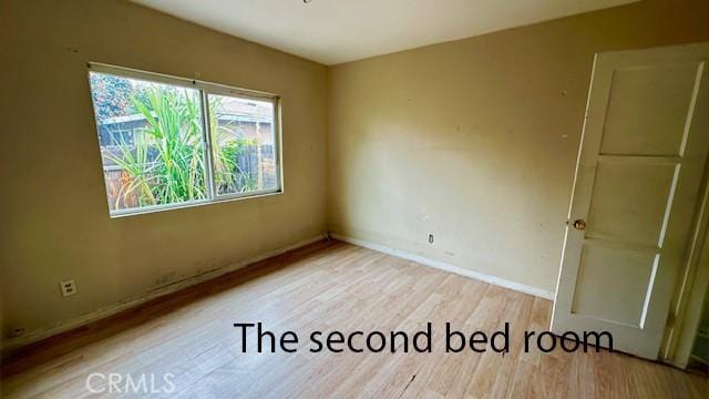 574 Davidson Ln, Pomona, CA 91768 - empty room featuring wood finished floors and baseboards