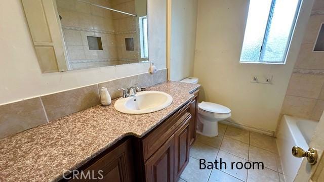 574 Davidson Ln, Pomona, CA 91768 - bathroom featuring toilet, vanity, and tile patterned floors