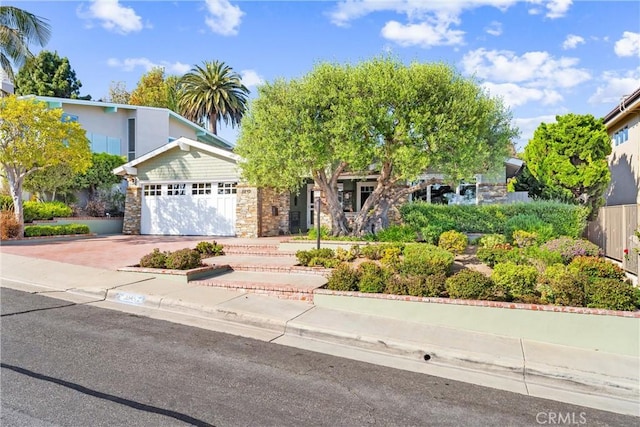 2245 Avenida Salvador, San Clemente, CA 92672 - view of front of home with stone siding, driveway, and a garage