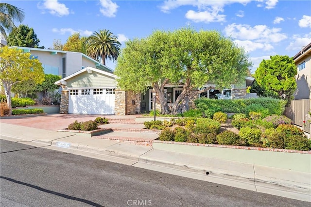 2245 Avenida Salvador, San Clemente, CA 92672 - view of front of property with stone siding, driveway, and a garage