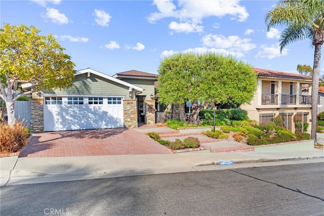 2245 Avenida Salvador, San Clemente, CA 92672 - view of front facade featuring decorative driveway, an attached garage, and stone siding