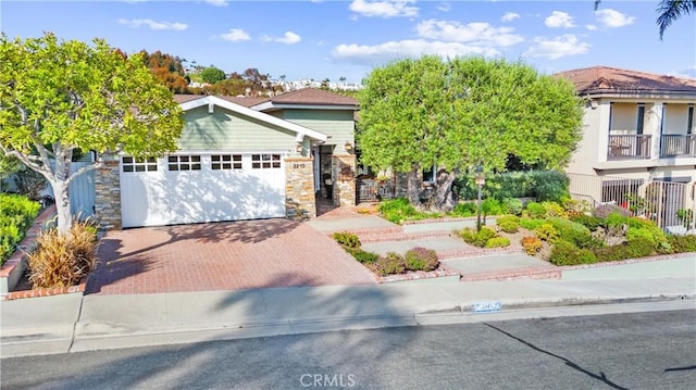2245 Avenida Salvador, San Clemente, CA 92672 - obstructed view of property with decorative driveway, an attached garage, and stone siding