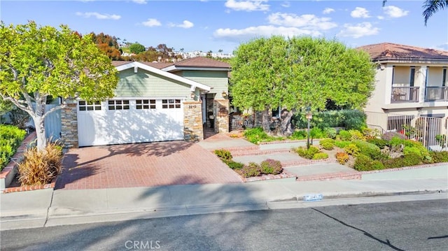 2245 Avenida Salvador, San Clemente, CA 92672 - view of property hidden behind natural elements featuring decorative driveway, a garage, and stone siding