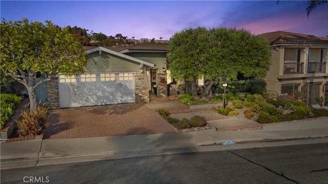 2245 Avenida Salvador, San Clemente, CA 92672 - obstructed view of property featuring an attached garage, decorative driveway, and stone siding