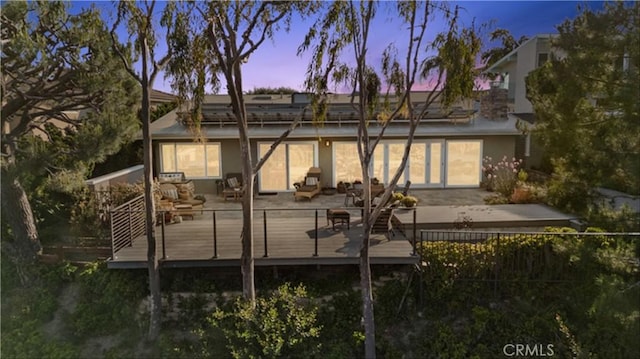 2245 Avenida Salvador, San Clemente, CA 92672 - back of house at dusk featuring stucco siding and a deck