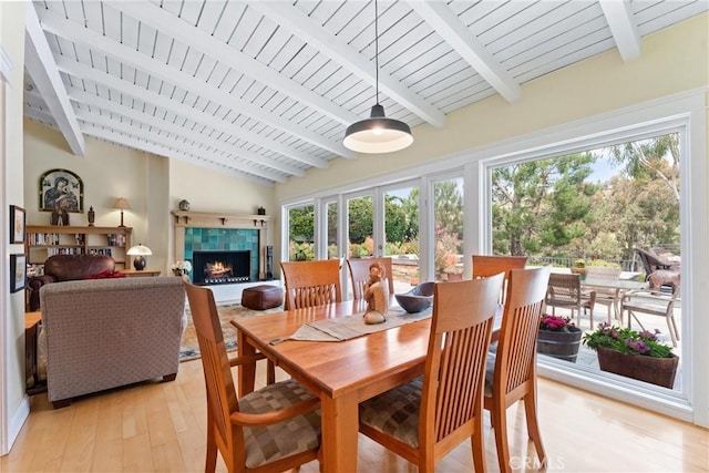 2245 Avenida Salvador, San Clemente, CA 92672 - dining area with light wood-style flooring, a fireplace, and wooden ceiling