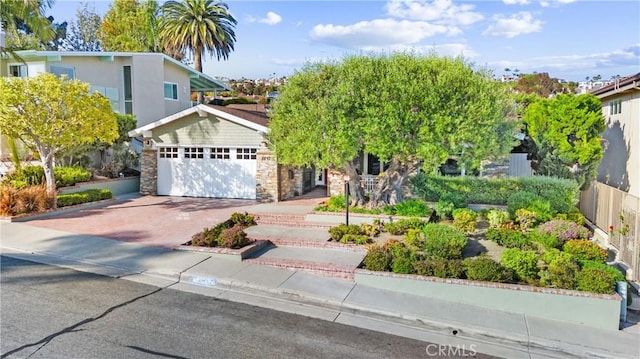 2245 Avenida Salvador, San Clemente, CA 92672 - view of front of home featuring a garage, stone siding, and driveway
