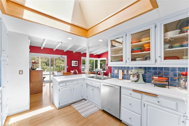 2245 Avenida Salvador, San Clemente, CA 92672 - kitchen with stainless steel dishwasher, a sink, light wood-style flooring, light countertops, and a peninsula