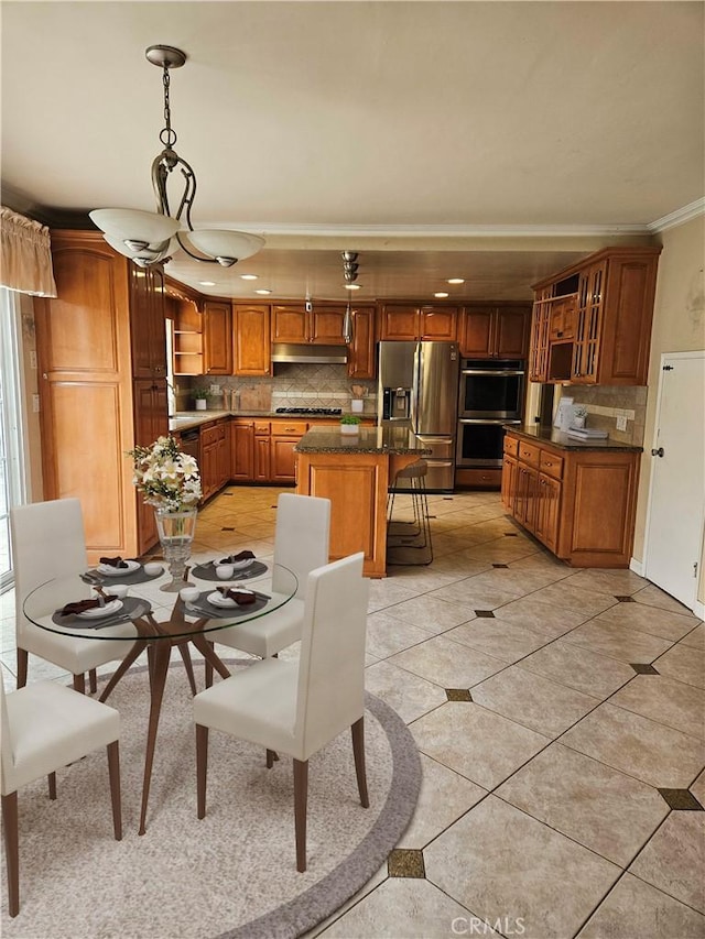 dining area with crown molding and light tile patterned floors