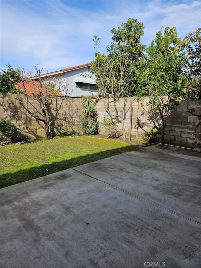 exterior space featuring a patio area and fence