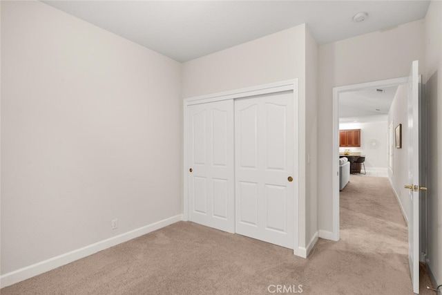 670 Grafton Park Dr, Chico, CA 95926 - unfurnished bedroom with a closet, light carpet, and baseboards