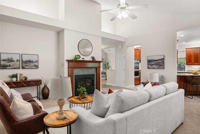 670 Grafton Park Dr, Chico, CA 95926 - living area featuring recessed lighting, ceiling fan, light carpet, a high ceiling, and a tile fireplace