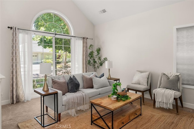 670 Grafton Park Dr, Chico, CA 95926 - living area featuring baseboards, visible vents, light colored carpet, and high vaulted ceiling