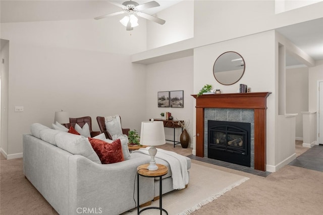 670 Grafton Park Dr, Chico, CA 95926 - carpeted living area featuring ceiling fan, baseboards, high vaulted ceiling, and a tile fireplace