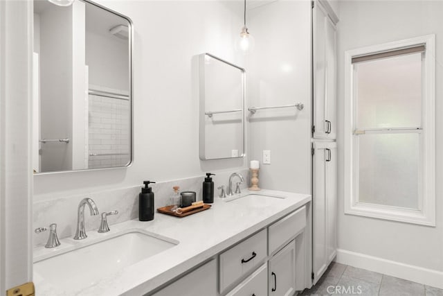 670 Grafton Park Dr, Chico, CA 95926 - bathroom with baseboards, tile patterned flooring, double vanity, and a sink