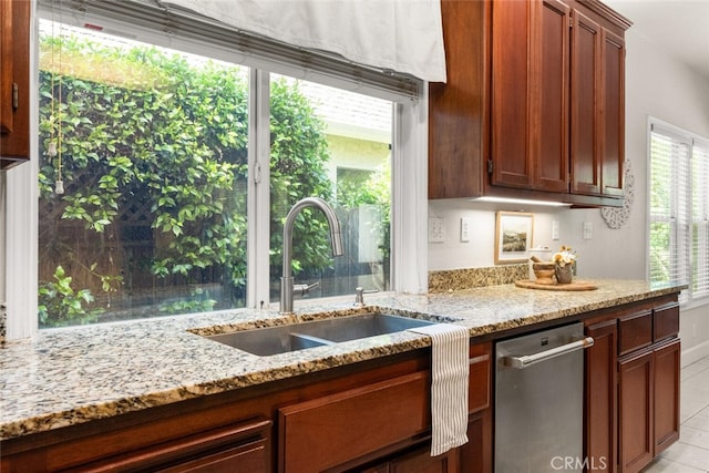 670 Grafton Park Dr, Chico, CA 95926 - kitchen featuring a sink, stainless steel dishwasher, light stone counters, and light tile patterned floors