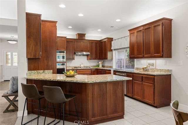 670 Grafton Park Dr, Chico, CA 95926 - kitchen featuring light stone counters, stainless steel appliances, a peninsula, and under cabinet range hood
