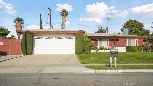 5427 Picker St, Riverside, CA 92503 - ranch-style home with driveway, a front lawn, and an attached garage