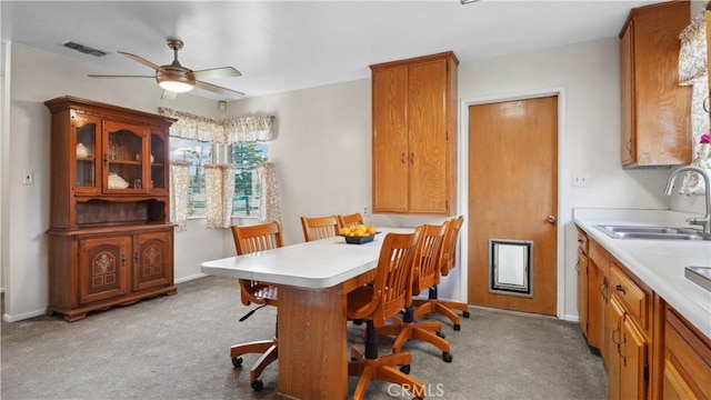 5427 Picker St, Riverside, CA 92503 - dining area featuring a ceiling fan, baseboards, and light colored carpet