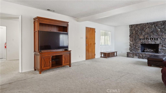 5427 Picker St, Riverside, CA 92503 - living area with carpet, a textured ceiling, beam ceiling, and a fireplace