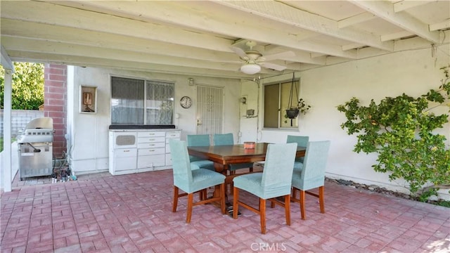 5427 Picker St, Riverside, CA 92503 - dining space with brick patterned flooring, a ceiling fan, and beam ceiling