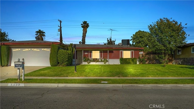 5427 Picker St, Riverside, CA 92503 - ranch-style home with a front lawn, driveway, and a garage