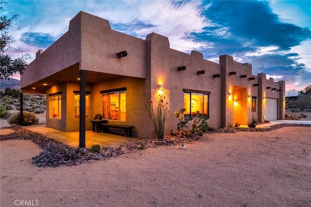 61465 Latham Trl, Joshua Tree, CA 92252 - view of side of home featuring a garage