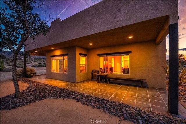 61465 Latham Trl, Joshua Tree, CA 92252 - back of house with a patio and stucco siding