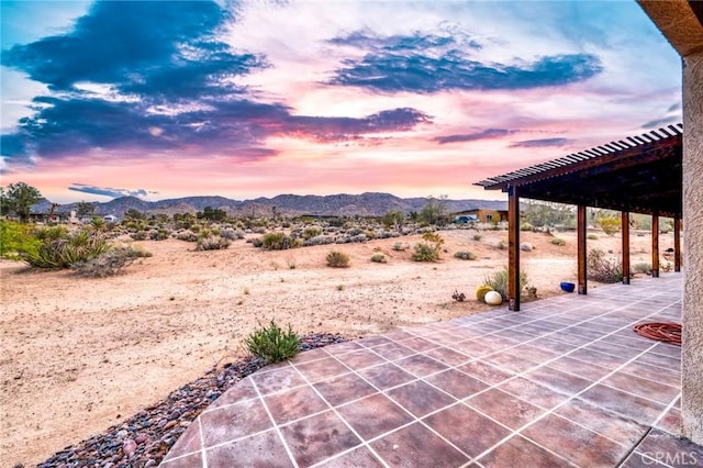 view of patio / terrace featuring a mountain view