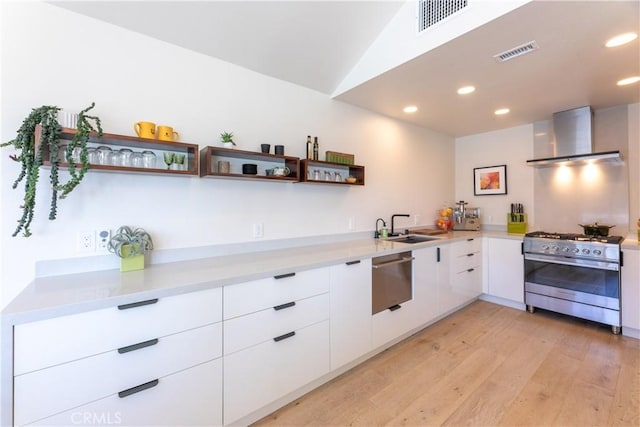 kitchen with wall chimney range hood, open shelves, visible vents, modern cabinets, and appliances with stainless steel finishes