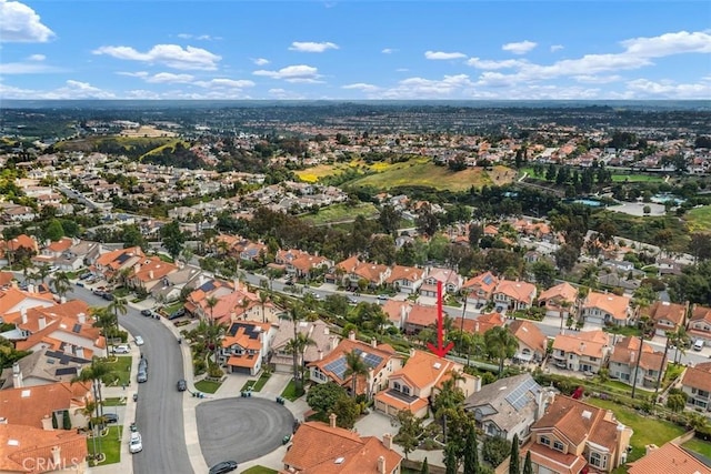 aerial view of property's location with nearby suburban area