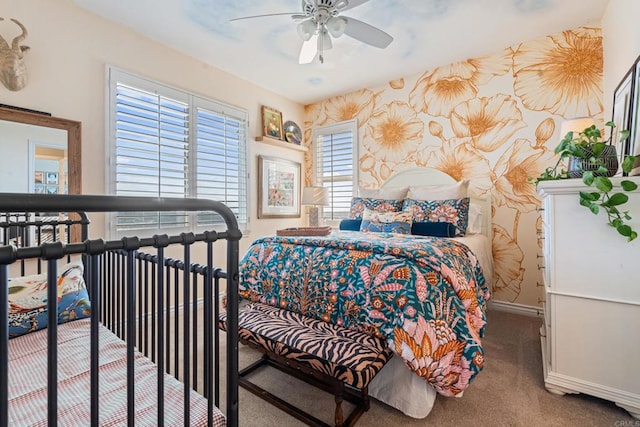 carpeted bedroom featuring baseboards, a ceiling fan, and wallpapered walls