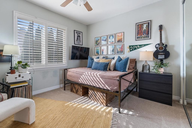 bedroom featuring baseboards and ceiling fan