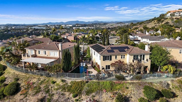 birds eye view of property with a residential view and a mountain view