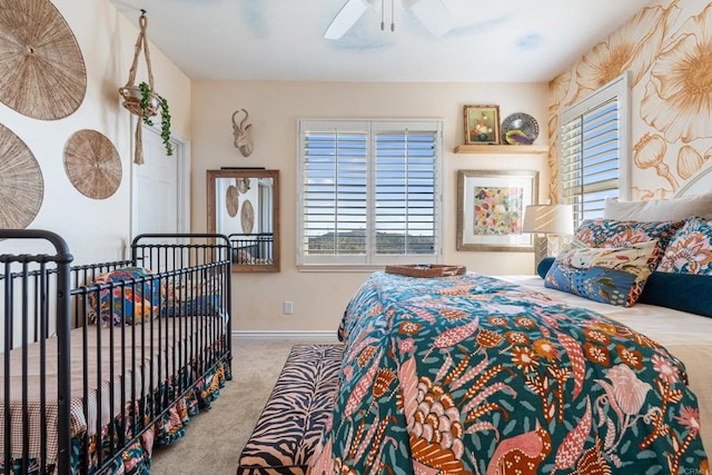 bedroom featuring carpet flooring, baseboards, and multiple windows