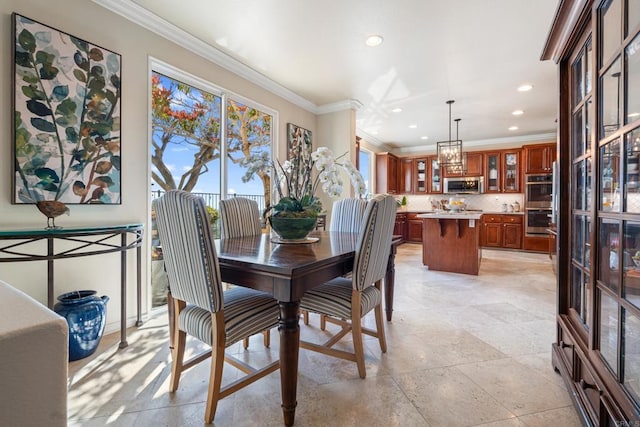 dining room featuring ornamental molding, a healthy amount of sunlight, and recessed lighting