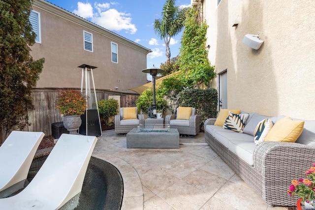view of patio featuring fence and an outdoor living space
