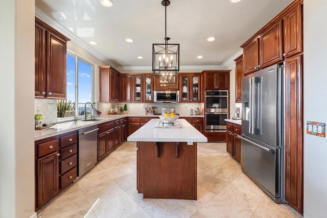 kitchen with light countertops, stainless steel appliances, crown molding, and a sink