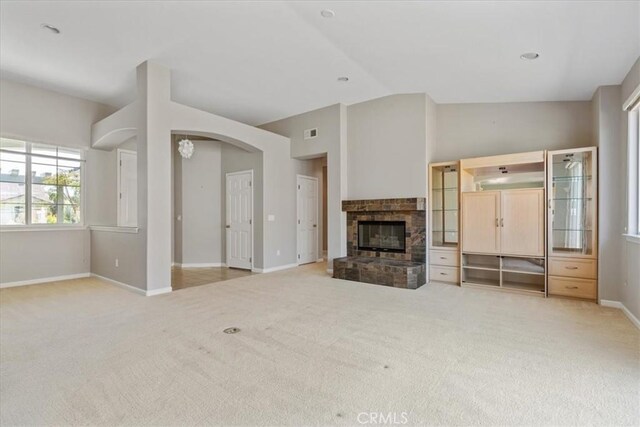 2331 Humboldt St, Los Osos, CA 93402 - unfurnished living room featuring carpet, baseboards, lofted ceiling, and a glass covered fireplace