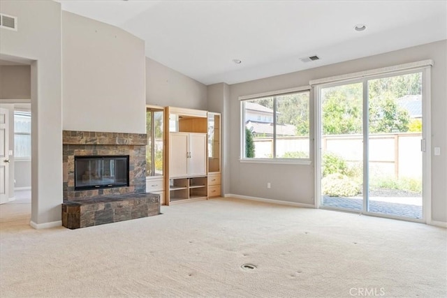 2331 Humboldt St, Los Osos, CA 93402 - unfurnished living room with carpet, lofted ceiling, baseboards, and a stone fireplace