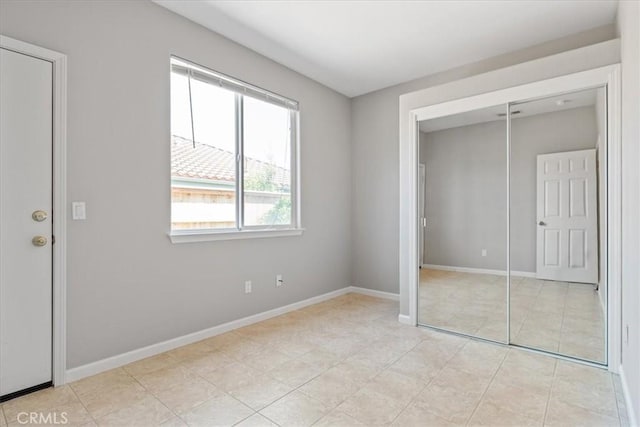 2331 Humboldt St, Los Osos, CA 93402 - unfurnished bedroom with a closet, baseboards, and light tile patterned flooring