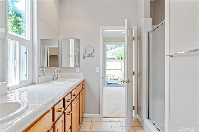 2331 Humboldt St, Los Osos, CA 93402 - bathroom featuring double vanity, a shower stall, tile patterned flooring, and baseboards